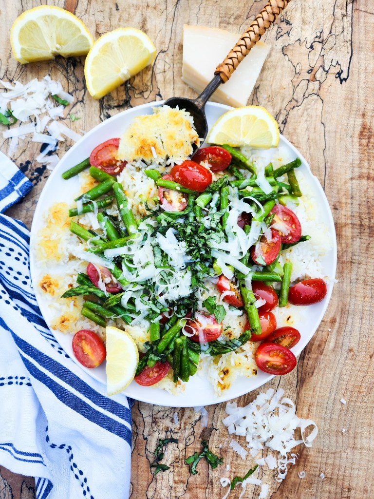 Asparagus-Tomato Crispy Rice transforms leftover rice into a delicious meal with asparagus, grape tomatoes, garlic and fresh grated parmesan.
