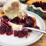 Wild Blackberry Pie with a light and flaky all butter crust, fresh picked blackberries served warm with vanilla ice cream.