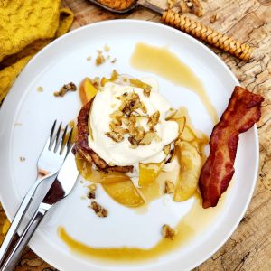 Caramel Apple French Toast uses leftover French bread topped with caramelized apples, fresh whipped cream and walnuts.