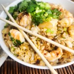 Seafood Fried Rice layers Dungeness crab, sea scallops and shrimp together with fresh herbs for a quick weeknight meal.