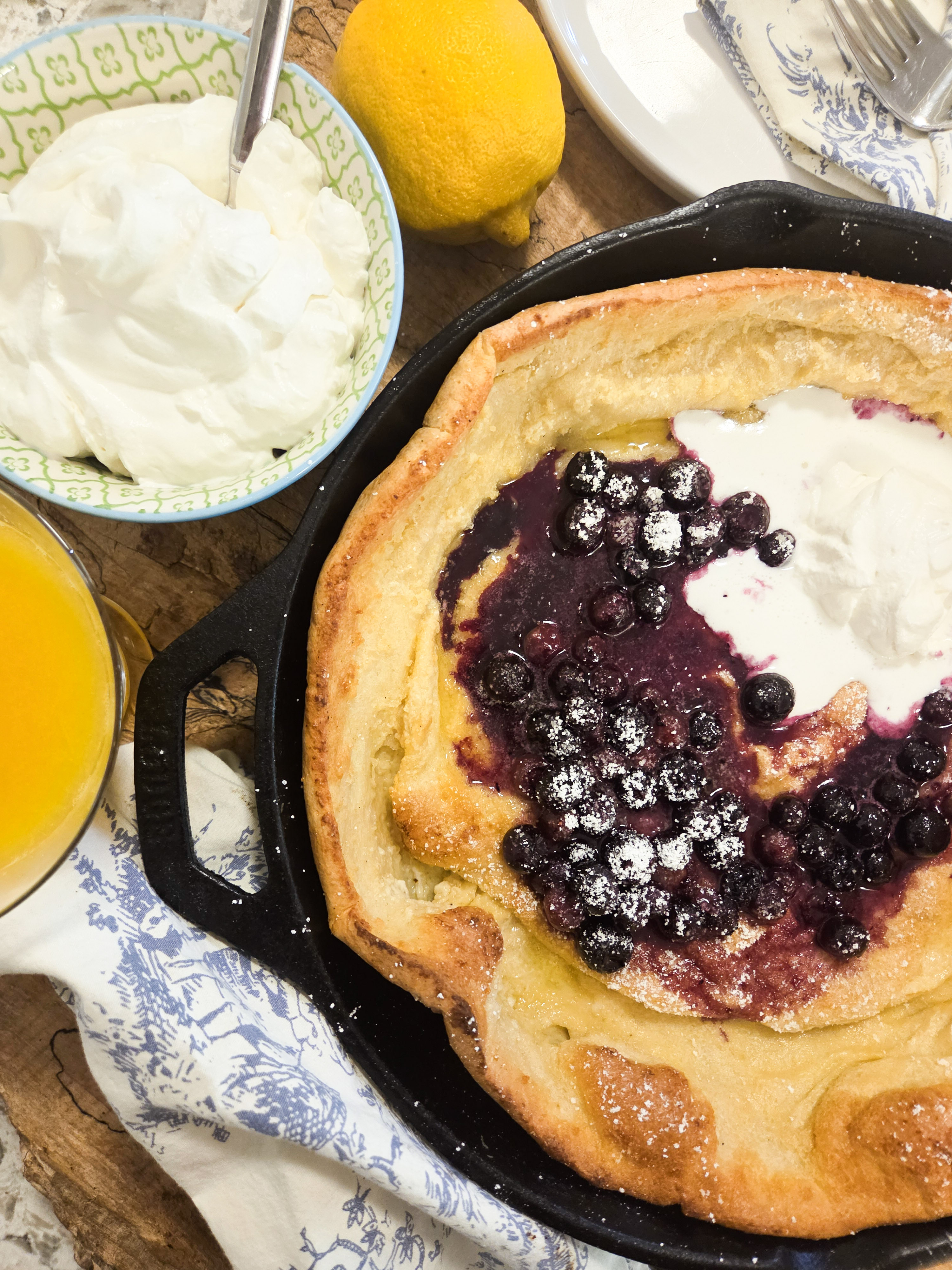 Lemon Blueberry Dutch Baby is light, fluffy and simple to make with blueberry sauce and lemon scented whipped cream.