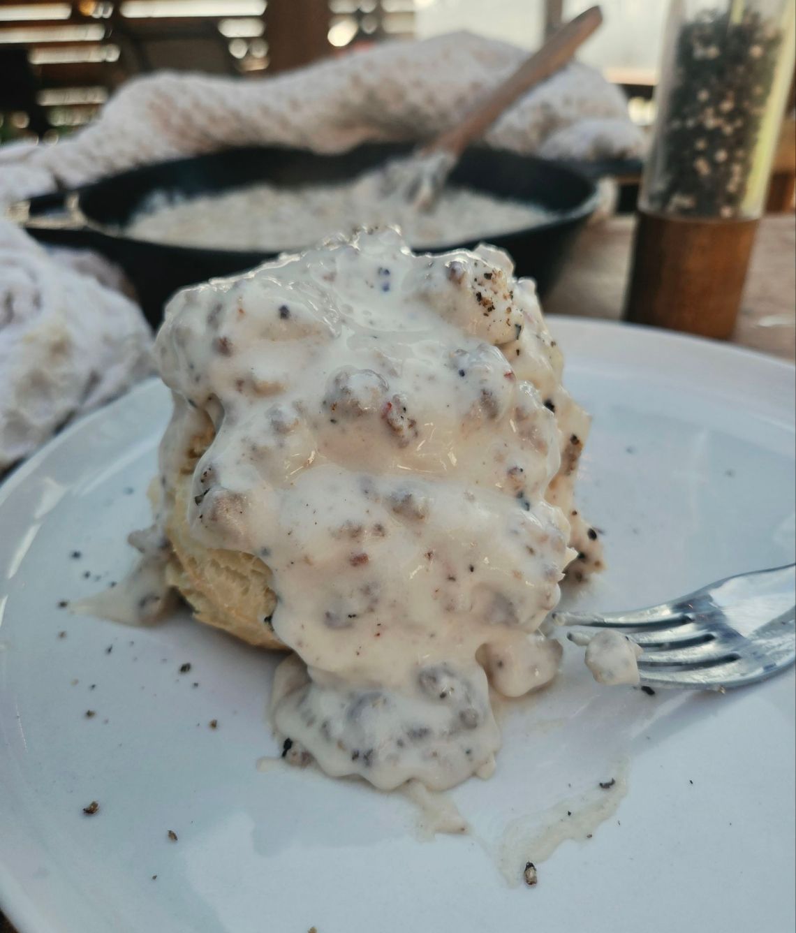 Fluffy layers of biscuit with creamy sausage gravy spooned over top