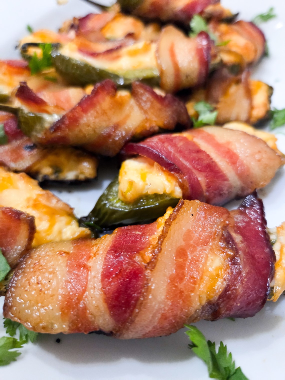 A plate of Smoked Jalapeno Poppers wrapped with bacon