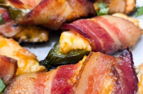 A plate of Smoked Jalapeno Poppers wrapped with bacon