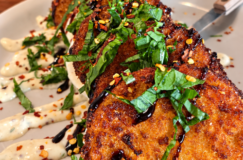Layers of Fried Green Tomato Caprese with fresh basil