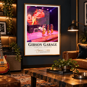 Gibson Garage Nashville wall art in a slim gold frame on a dark navy wall with leather seating, guitars, and modern music-inspired decor.