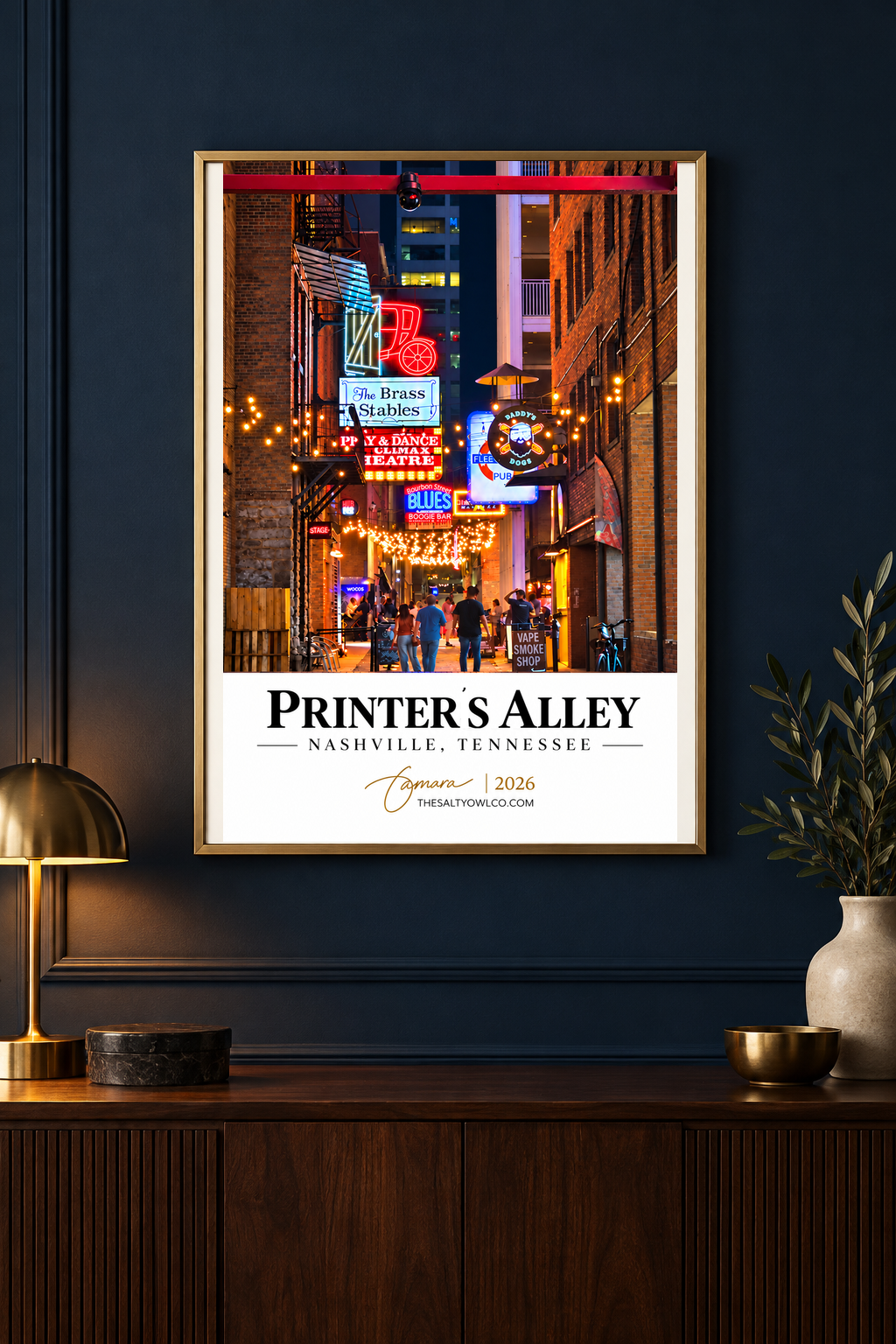 Printer’s Alley Nashville wall art in a gold frame in a moody dark-blue room