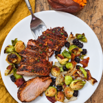 Sliced honey Cajun smoked pork loin with roasted Brussels sprouts and onions