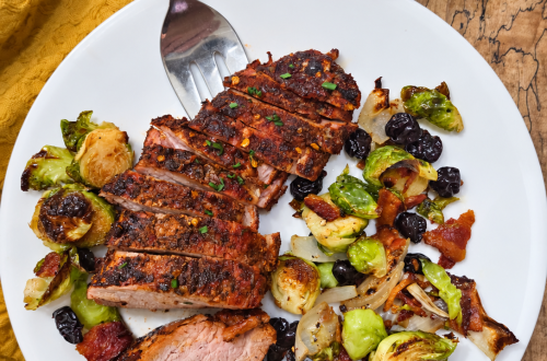 Sliced honey Cajun smoked pork loin with roasted Brussels sprouts and onions