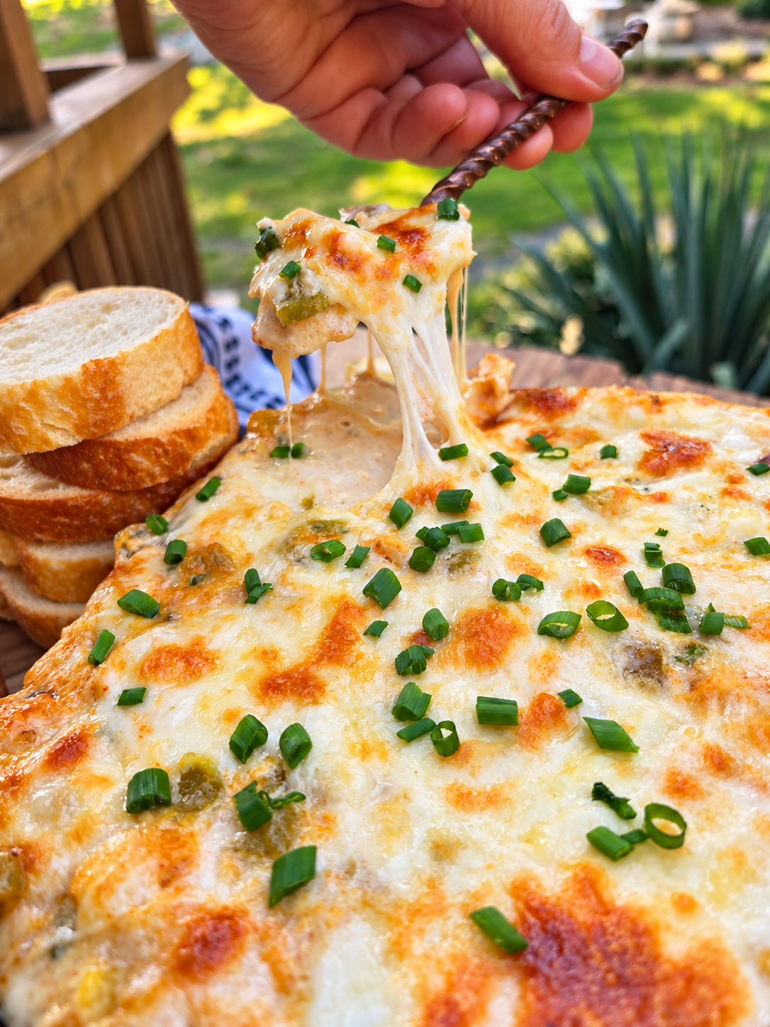 Warm Dungeness crab dip with green chiles, Jack cheese, smoked paprika, and chives.
