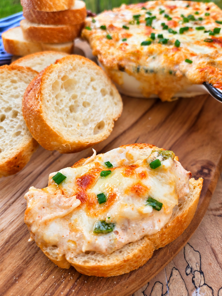 Warm Dungeness crab dip with green chiles, Jack cheese, smoked paprika, and chives.